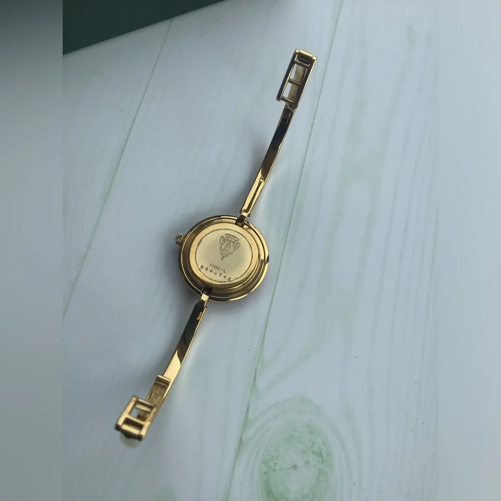 Gucci Women’s Gold Bangle Watch with Interchangeable Color Bezels